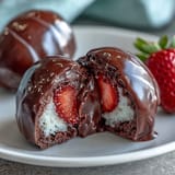 Dubai Chocolate Strawberry Easter Eggs with Crunch Filling: glossy chocolate eggs filled with strawberry-infused white chocolate and crunchy hazelnut cereal center, perfect for Easter celebrations.
