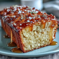 Golden Lemon Lavender Loaf Cake with glistening honey glaze, a delightful baked treat.